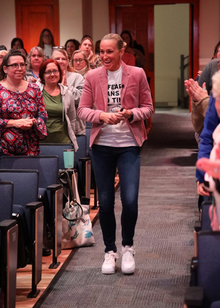 Missy West talking to a group of teachers