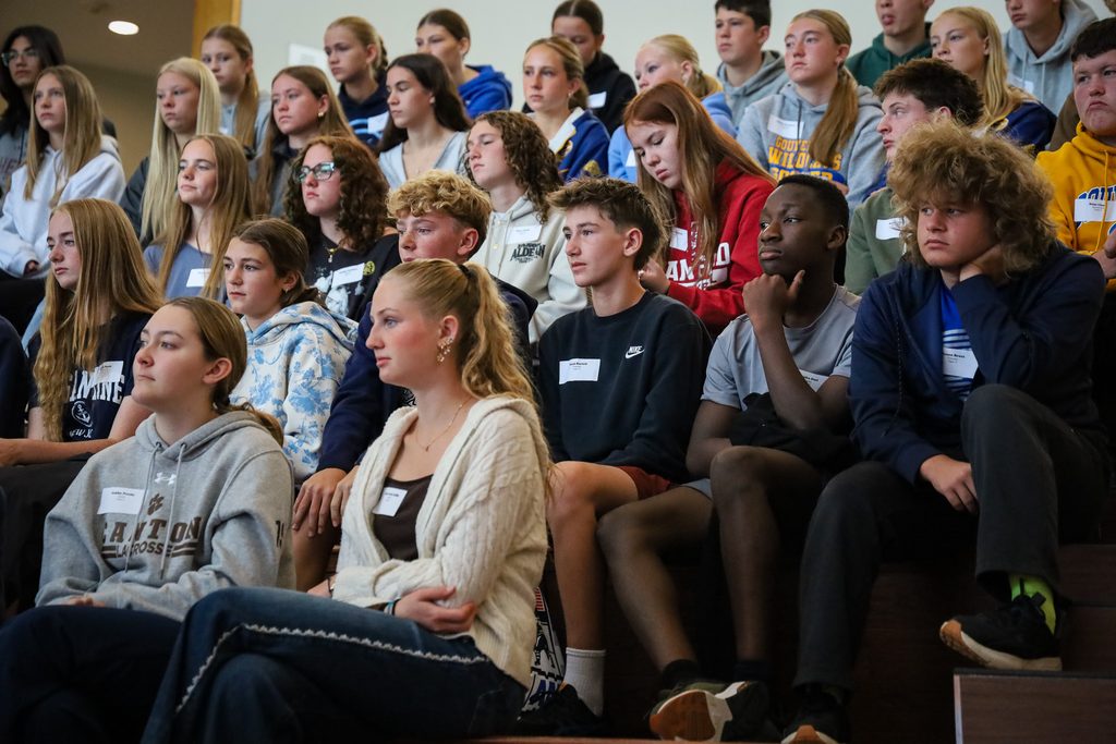 students sitting in bleachers