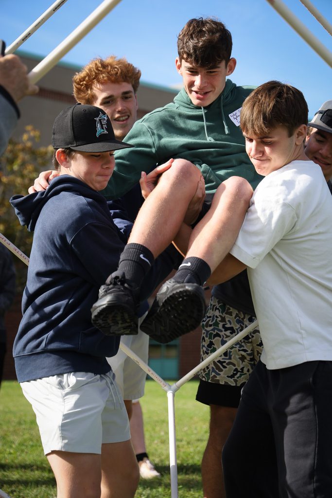 students carrying another student