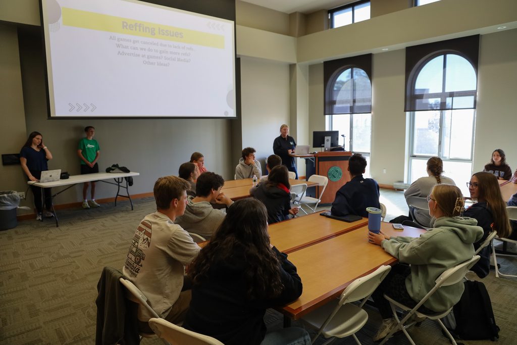 students listening to a presenter