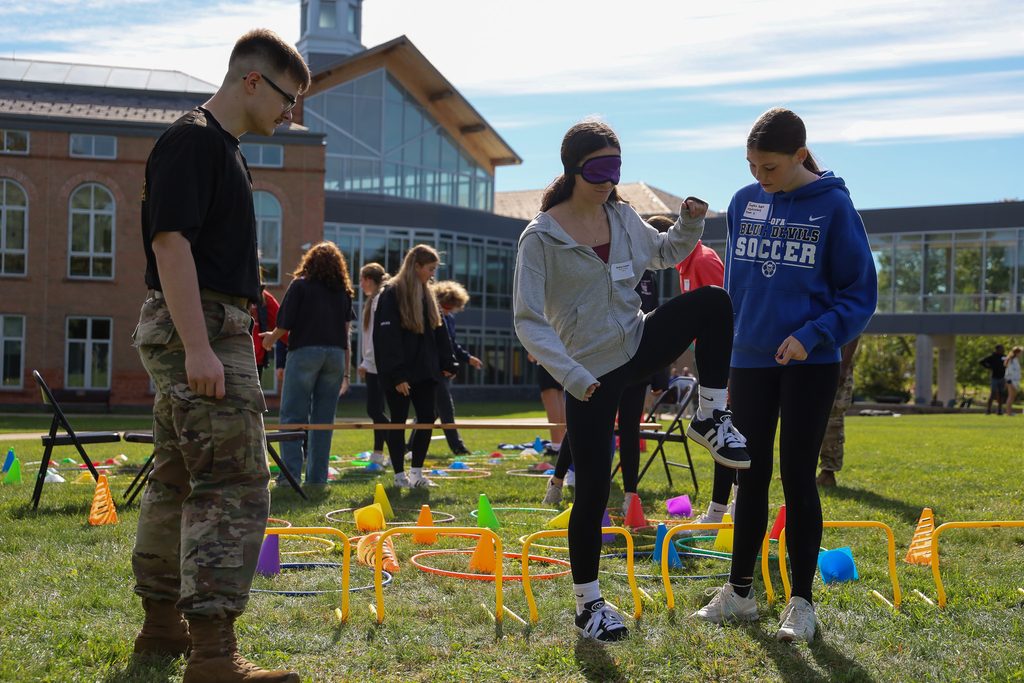 student stepping over an obstacle